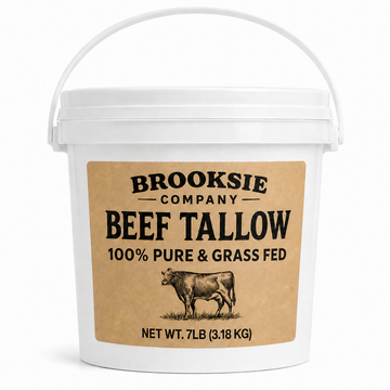 A white plastic bucket with a handle, featuring a tan label that reads 'Brooksie Company Beef Tallow 100% Pure & Grass Fed' with an illustration of a cow. The bucket is photographed on a clean white background.