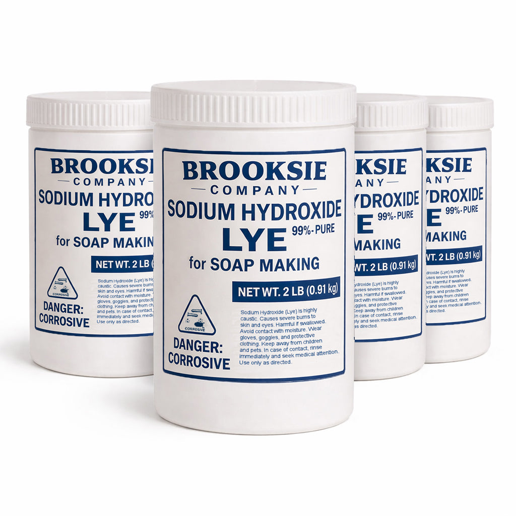 Three white plastic jars of Brooksie Company Sodium Hydroxide Lye for soap making, arranged in a row against a white background.